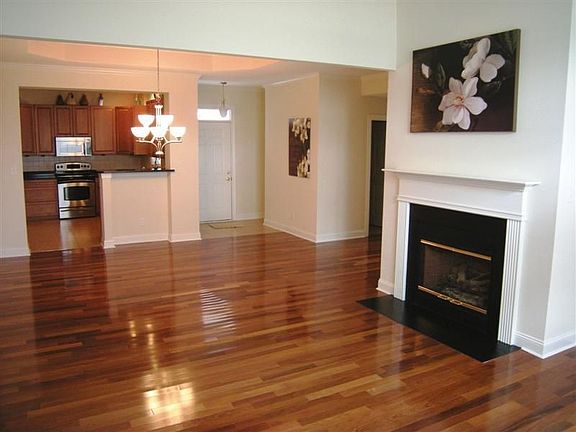  Teak hardwoods throughout home including the greatroom with gas fireplace