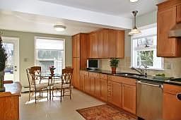 Spacious gourmet kitchen offers plenty of room, granite countertops