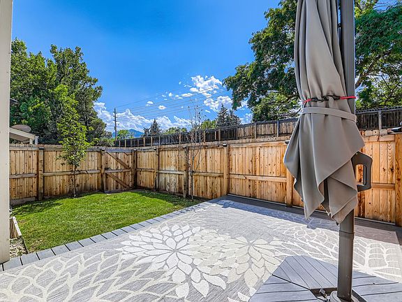 Enclosed patio, with large umbrella