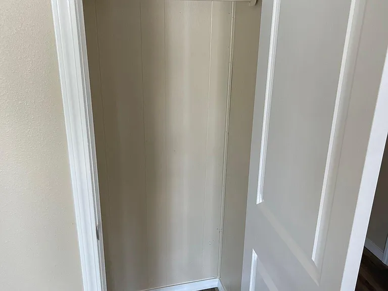 Coat closet in living room entryway