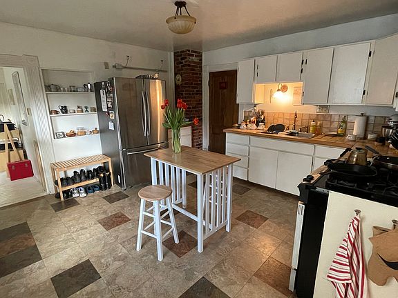 Kitchen now has new 'hardwood" floor and granite countertops.