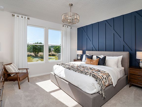 A cozy Owner s Suite with Shiplap wall detail