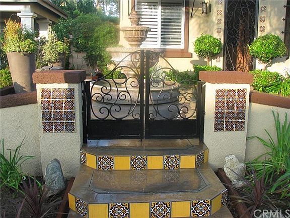 Large center piece fountain inside of tranquil courtyard setting.