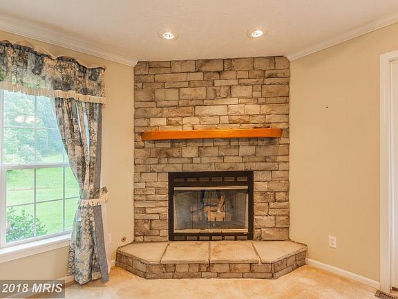 Family Room With Stone Gas Fire Place