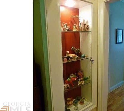 Beautiful built-in display cases between the entry foyer and the living room.