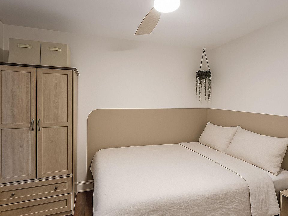 Room with a brand new smart TV, mini 2-door fridge, electric standing desk, and whisper-quiet fan.