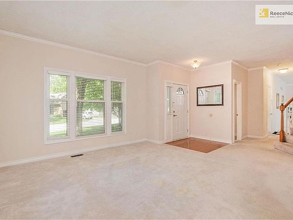 A view of the living room toward front door.