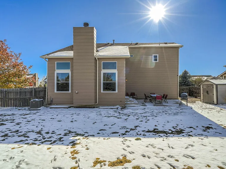Fully fenced in yard with plenty of seating and a grill!