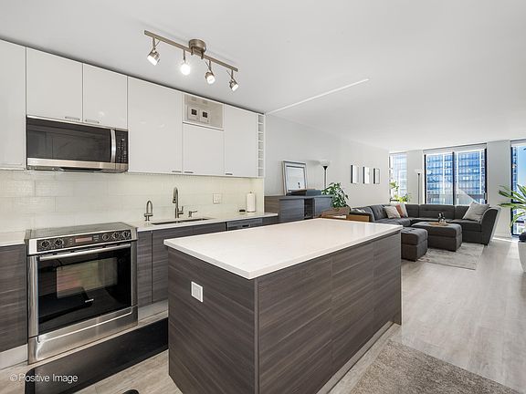 Open Kitchen with room to work. Has wine refrigerator