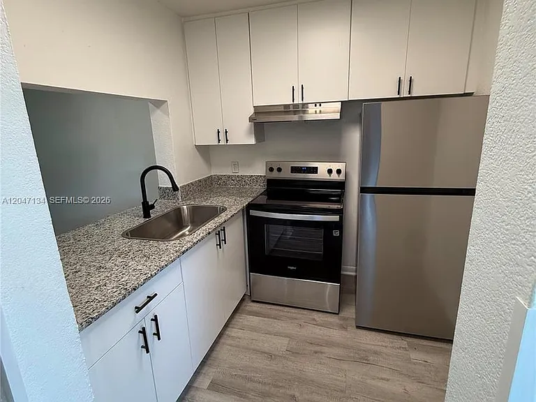 1220 NW 103rd Ln #413 — Photo 1