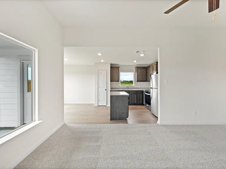 The open layout connects the family room with the kitchen and dining room.