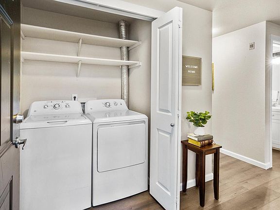 Front closet has full size washer and dryer and extra storage.