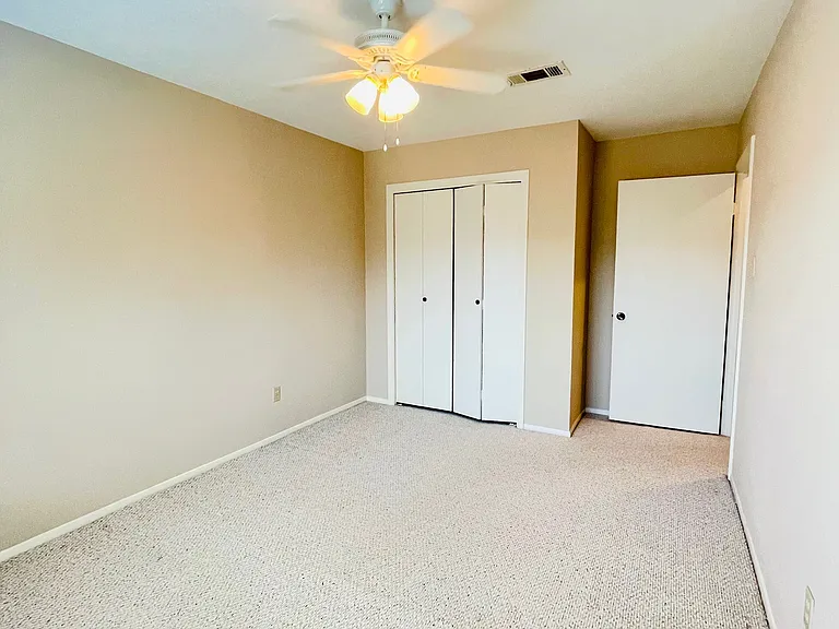 Bedroom #2, fits a full/queen size bed, with table and desk