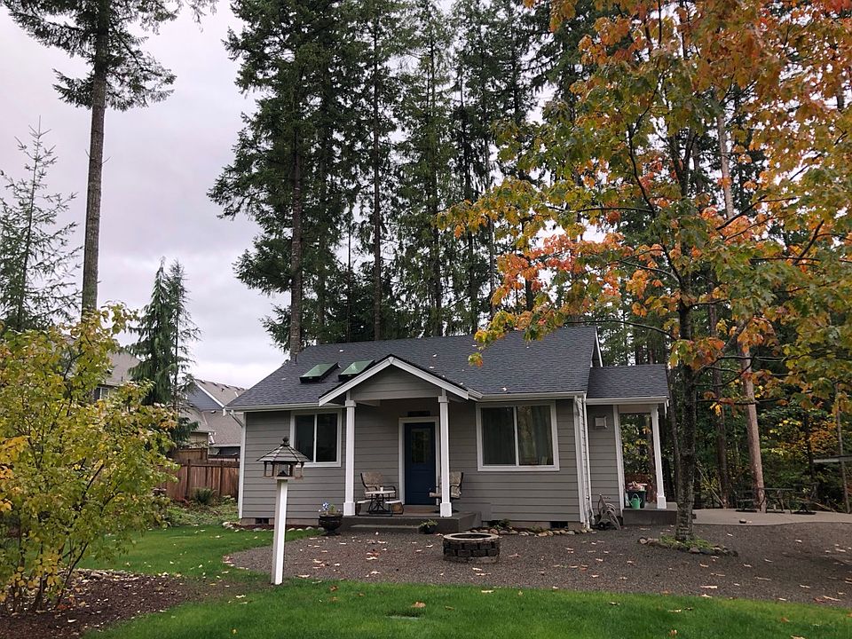 Front of the house. Small grassy area in front of the house. Not seen: grassy area on side of the house.