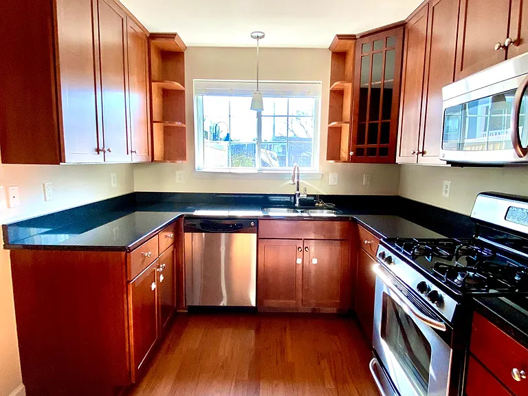 Kitchen with stainless steel appliances and plenty of storage.