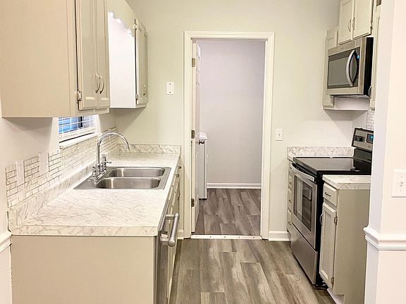 Galley Kitchen with updated cabinets and new appliances