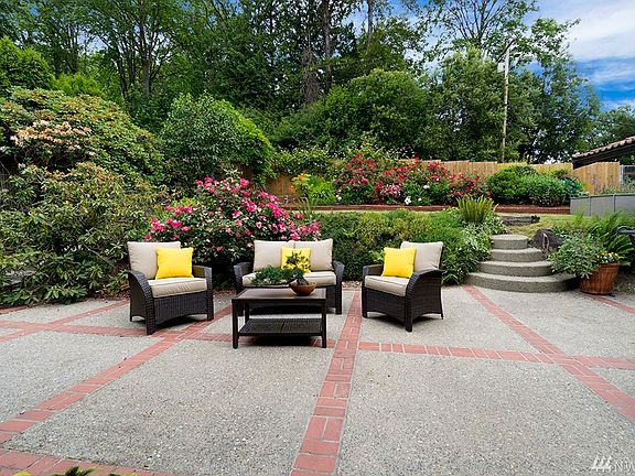 The back gardens are the relaxing oasis you've been looking for!  With oversized patio, concrete stairs that lead to the upper lawn, and a double gate for RV pull-in AND for easy access to the City-maintained walking trails behind!  Full privacy here!