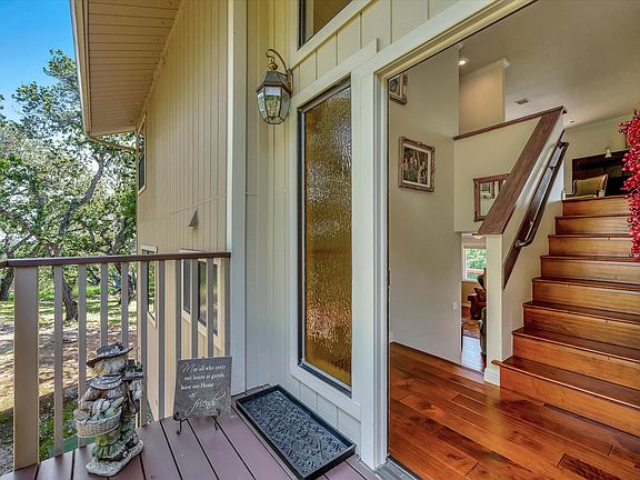 Main house front door entrance. House offers beautiful hardwood floors