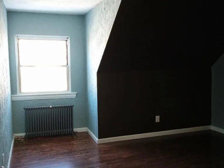 Third floor bedroom with small closet