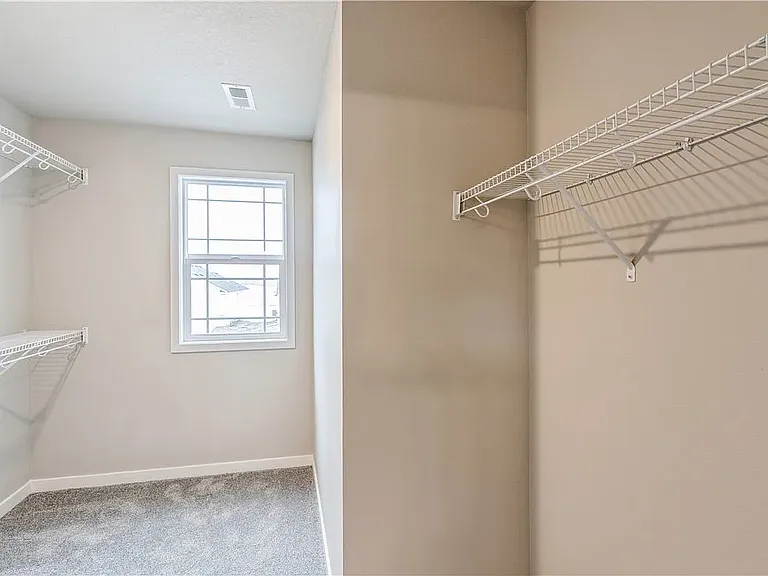 Huge walk-in closet in master bedroom.