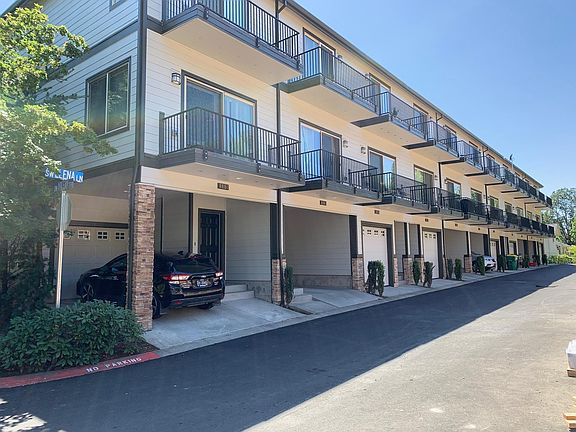 Front entry and single-car garage is 4th unit from the left