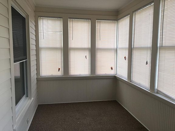 Enclosed front porch.