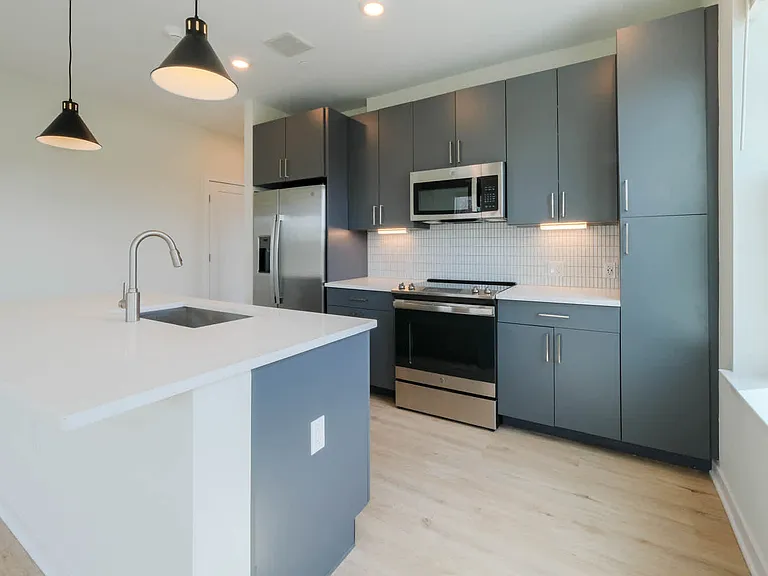 Kitchen with Stainless Steel Appliances and Dark Cabinets