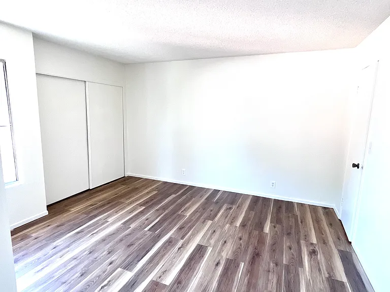 ensuite bedroom w/ two closet spaces