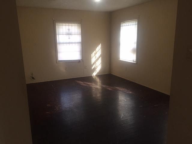 Large living room 13x15. work in process, floors being refinished, painting now, new ceiling fan :)