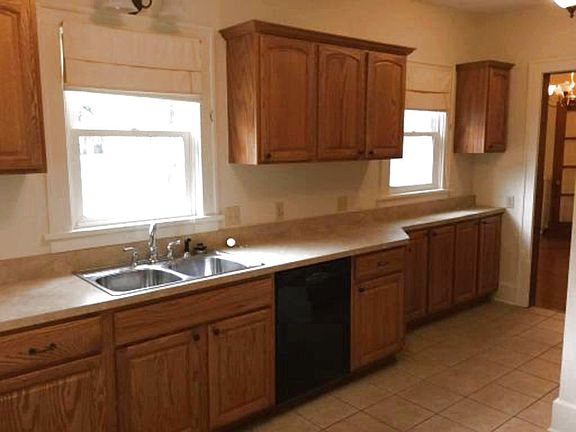 Main house kitchen with oak cabinets and ceramic flooring - includes dishwasher, disposal, electric stove and microwave...