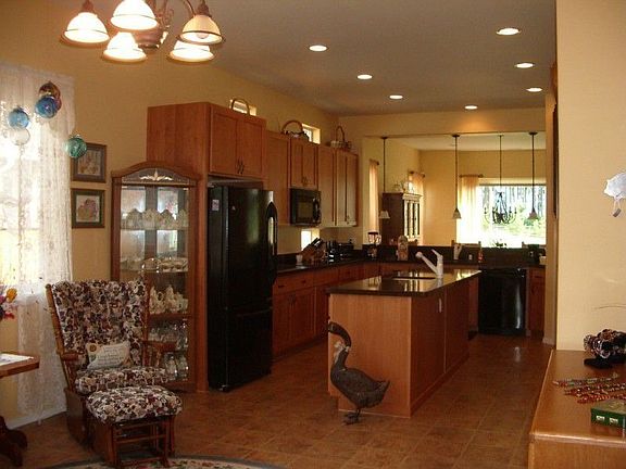 Right off the kitchen is a large nook where you can engage in dining or use as a hobby area, TV area
