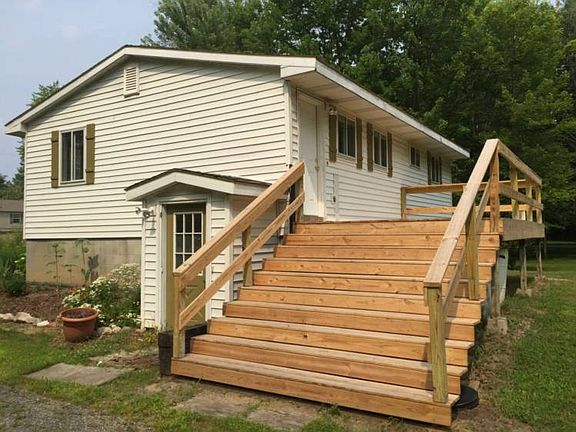 The brand new deck overlooks the huge back yard.