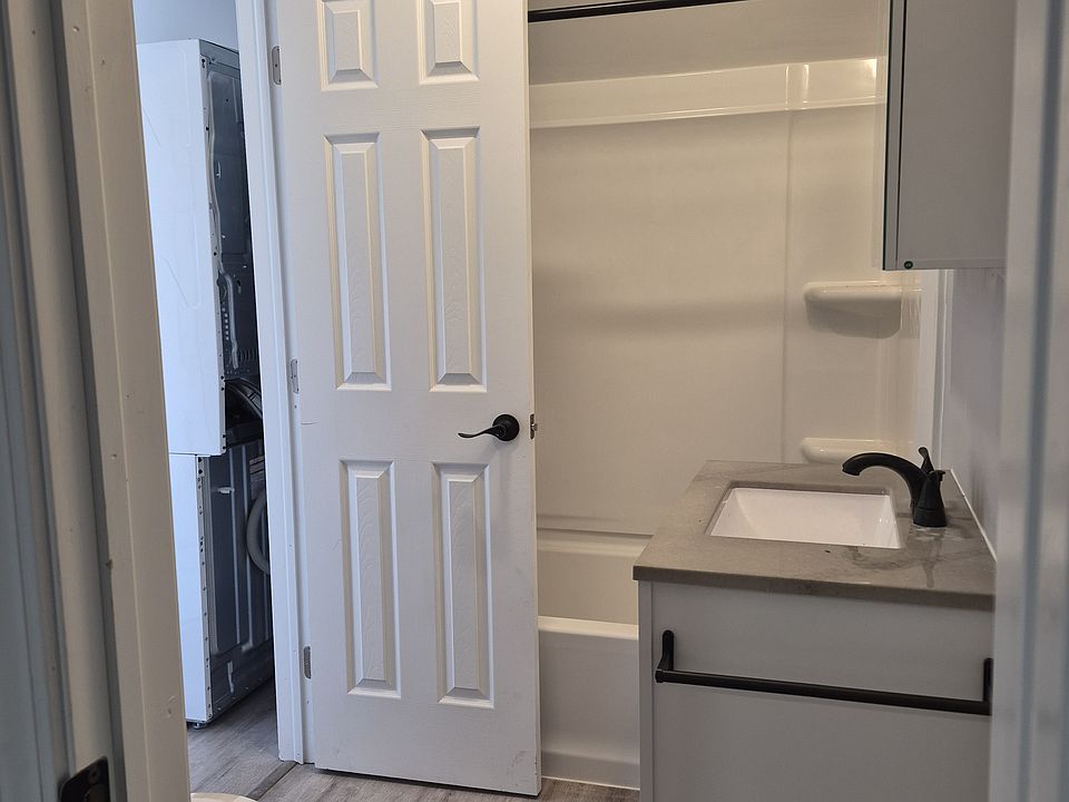bathroom from door in bedroom, other door goes out by laundry