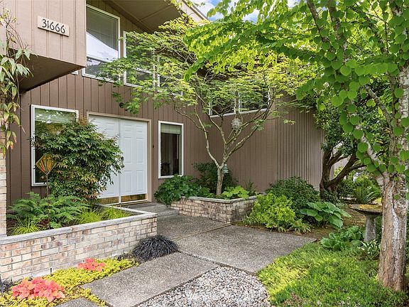 Exposed aggregate drive & pathway to double front doors.