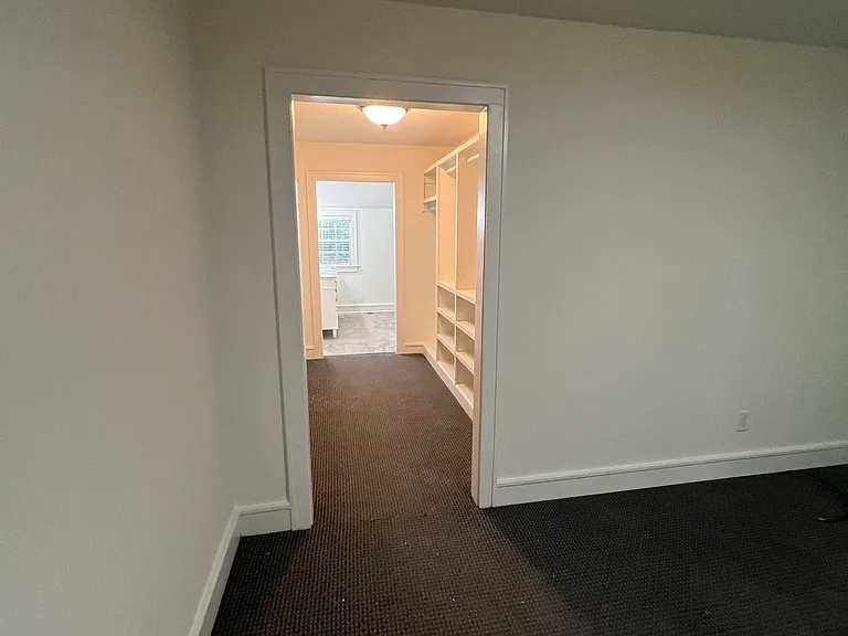 Primary bedroom opens into great closet and primary bath