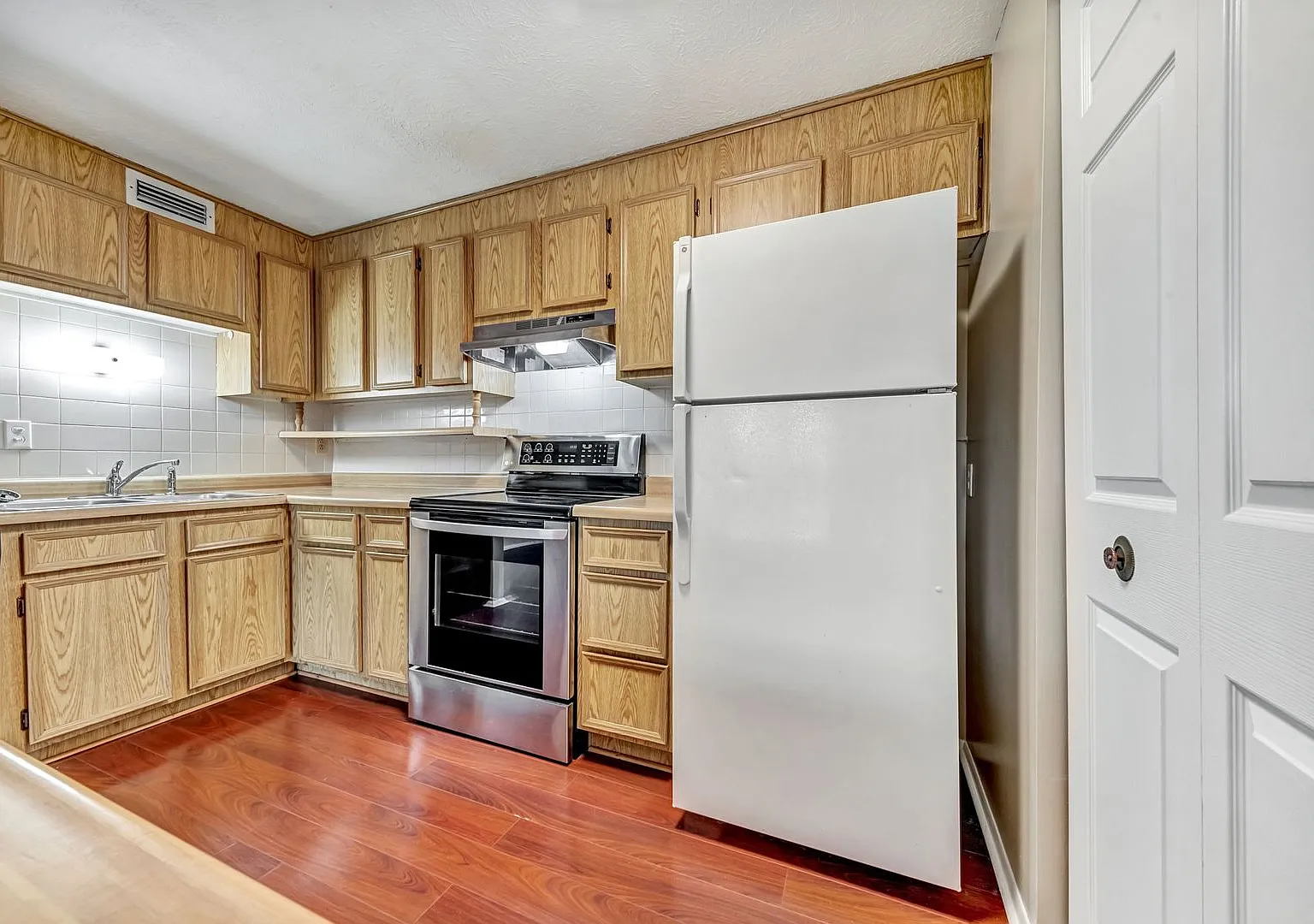 Tranquil Two-Bedroom Condo: Park Setting, Prime Location, Modern Comforts! — Photo 1