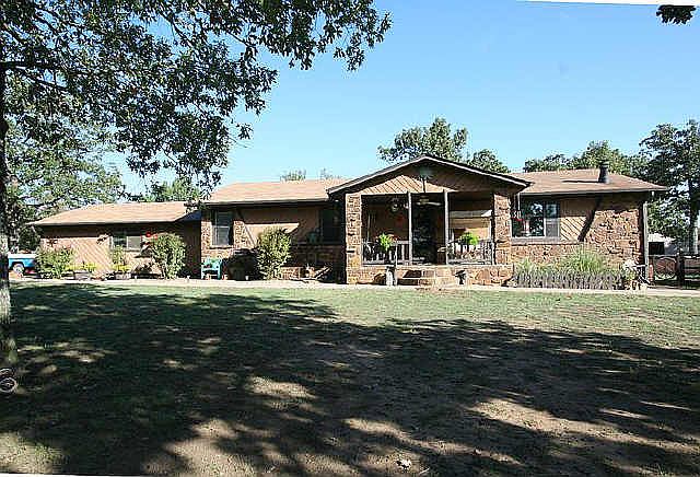 Beautiful stone facade with front porch for swinging!