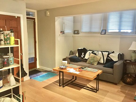 Seating area in the living room with lots of windows and nook