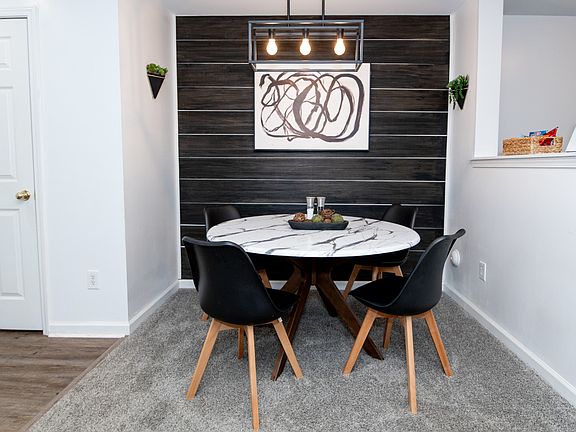 Dining area and half bath are accessible from the living area.