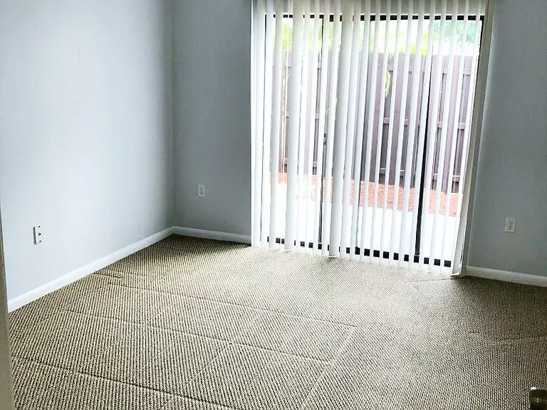 The downstairs bedroom overlooks the private, fenced patio, has a walk-in closet and ensuite bath.
