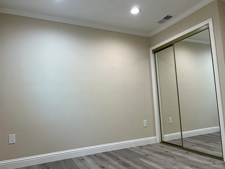 View of Bedroom unfurnished with mirrored closet doors