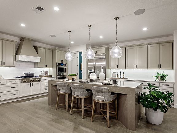 Well designed kitchen with dramatic quartz center island