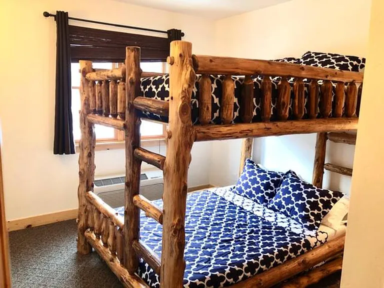 Custom queen-over-queen rustic bunk bed - great for hosting out of town guests!
