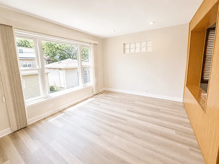 A versatile bonus room off the kitchen provides additional living space and can be used as a family room, dining room, home office, playroom, or flex space to fit your lifestyle.