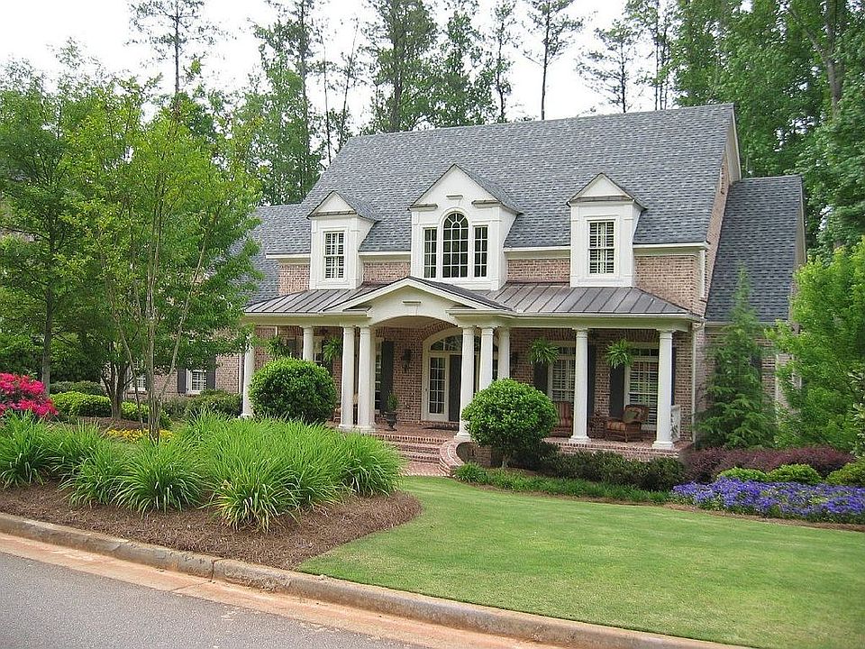Four sided brick home with three car garage 