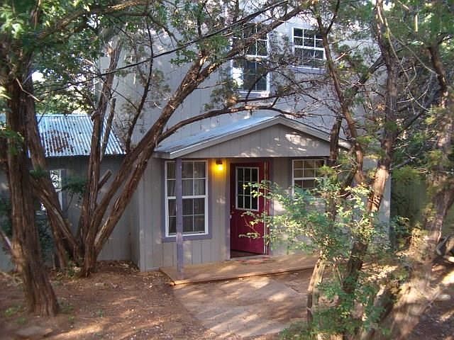Great cabin nestled in the trees.  This is the main  entrance to the house.