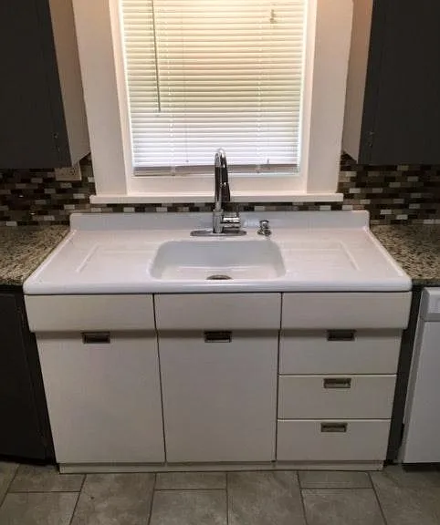 maintained the historic sink to respect the history of the h
