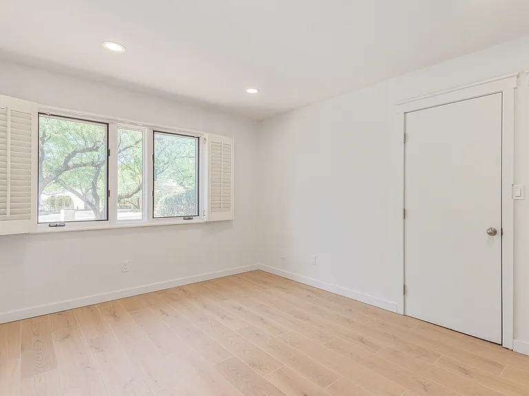 BEDROOM #3 WITH NATURAL LIGHT AND SHUTTERS AND TWO CLOSETS