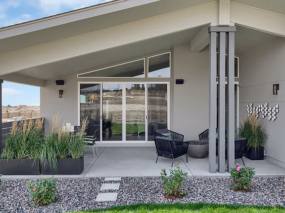 Exterior covered patio. Photo representing home to be built and may demonstrate optional features