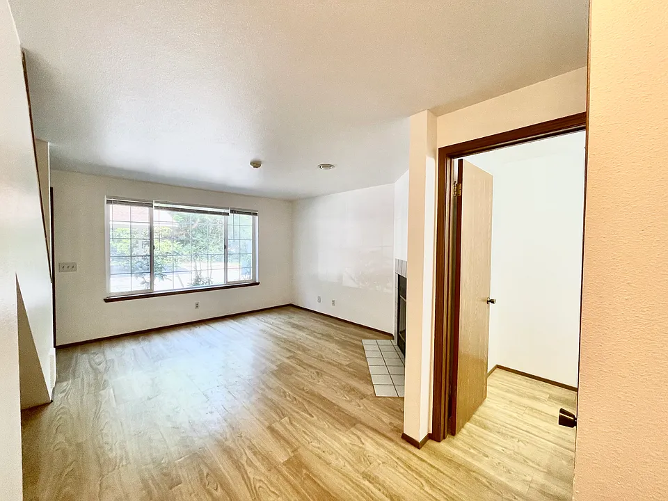 Living Room (fireplace to be removed). 
Access to half bath on main level.